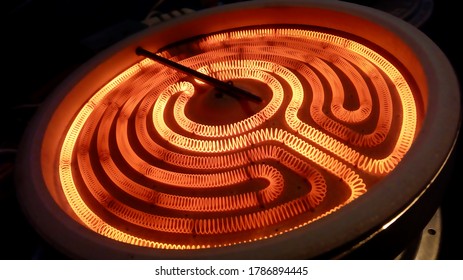 close up of kitchen stove burner inside electrical resistance thermostat cooking food technology wire cables fire electricity heat power ac ceramic induction hob repair technician recipe chef