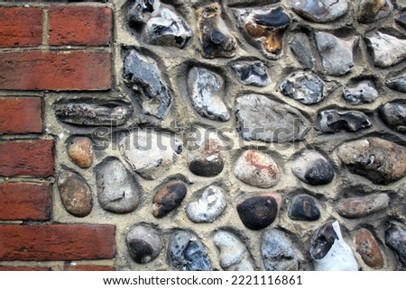 close up knapped flint wall and red bricks