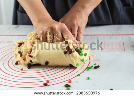 Close Up Kneading Raw Bread Dough with Dried Fruit and Raisin, Process Step by Step Making Christmas Stollen German Bread