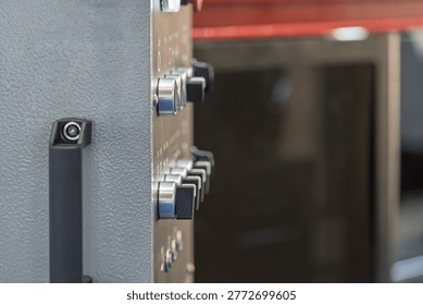 Close Up of Knobs on Industrial Equipment Control Panel