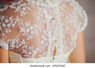 Close Up Of Lace Back Of Wedding Dress