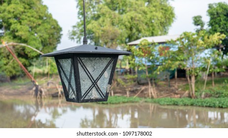 Close up lamp and river in background.