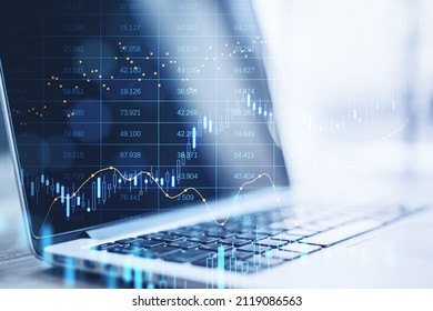 Close up of laptop computer with abstract glowing big data forex candlestick chart on blurry background. Trade, technology, investment and analysis concept. Double exposure