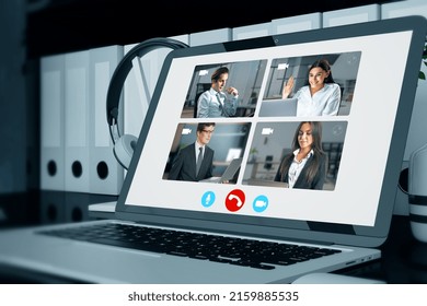 Close up of laptop computer with creative video conference call on screen. Work, home and remote team concept