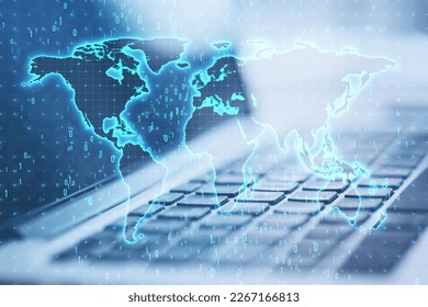 Close up of laptop computer with glowing binary code map hologram on blurry background. Software and global technology concept. Double exposure