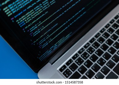 close up laptop computer screen with programming code creating