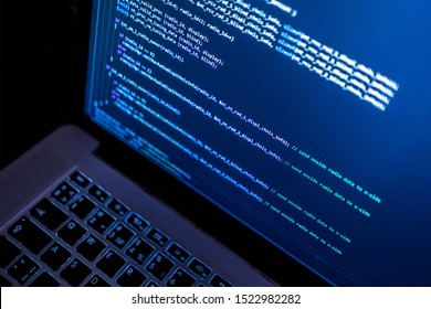 close up laptop computer screen with programming code creating