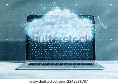 Close up of laptop with digital glowing polygonal cloud mesh on blurry background. Storage technology concepts transfer data to cloud computing platforms