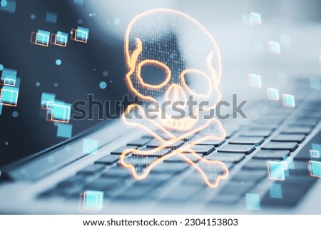 Close up of laptop with glowing digital binary code skull on blurry background. Hacking, piracy, malware and data theft concept. Double exposure