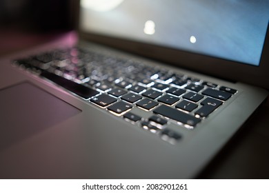 Close up of laptop keyboard colorful neon illumination, backlit keyboard. - Shutterstock ID 2082901261