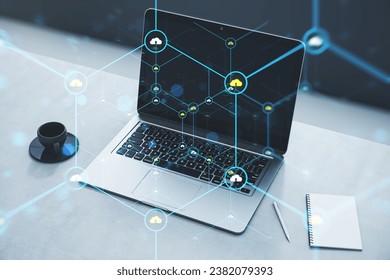 Close up of laptop on desk with coffee cup, notepad and creative glowing hexagonal pattern with tiny padlocks on blurry background. Digital security and firewall concept. Double exposure