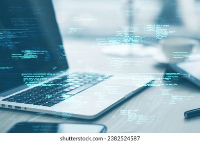 Close up of laptop on desk with supplies and creative coding html language on blurry background. Web developer and programming concept. Double exposure - Shutterstock ID 2382524587