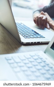 close up laptops. hands multitasking man using laptop connecting wifi