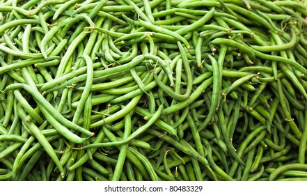 A close up of a large pile of string Beans.