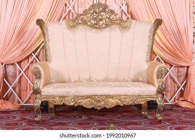 close up of leather couch on a stage with reception decoration in indian wedding