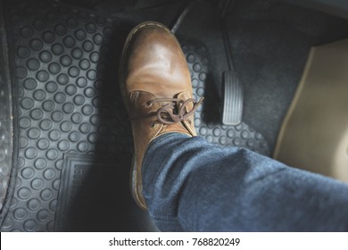 Close Up Leather Shoe On Pedal In Car