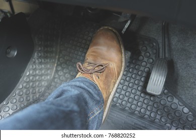 Close Up Leather Shoe On Pedal In Car