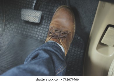 Close Up Leather Shoe On Pedal In Car