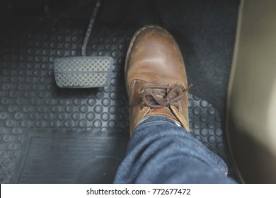 Close Up Leather Shoe On Pedal In Car