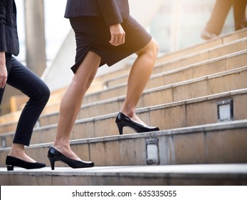 Close up legs of businesswoman walking stepping up stair in modern city, business growth, go up, success, grow up business concept