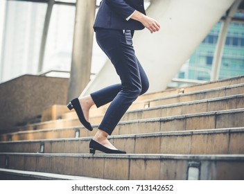 Close up legs of businesswoman walking stepping up stair in modern city, business growth, go up, success, grow up business concept