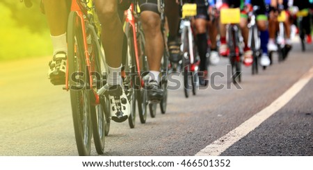 Close up legs Groups bicycles competition on paved roads
