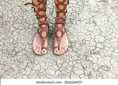 Close Up Of Woman’s Legs In Roman Style Sandals