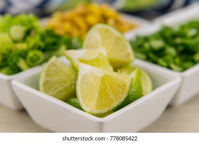 Close Up Of Lime Wedge In White Ceramic Bowl