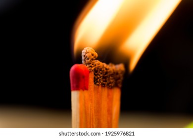 Close Up The Line Of Matchstick Be On Fire Make A Big Flame In Dark Background.