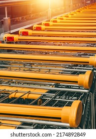 Close Up A Line Of Shopping Carts. Handcart In The Supermarket. The Concept For News Header Image Regarding Food Prices And Shortage.