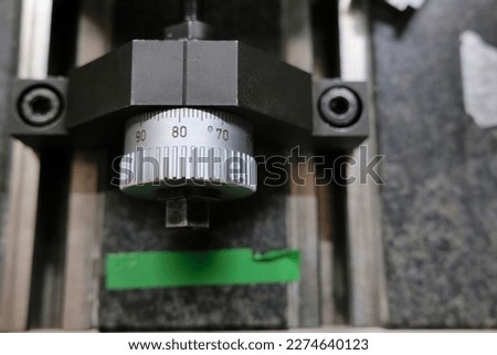 Close up of a linear positioning wheel mounted on rails