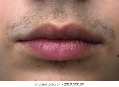 Close up of a woman’s lips with a hairy mustache
