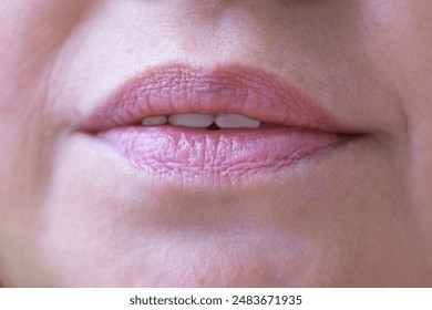 close up lips of mature female face, happy 50-year-old woman with gentle smile, Anti-aging Procedures in mature age concept, Women's Health and Self-Esteem - Powered by Shutterstock