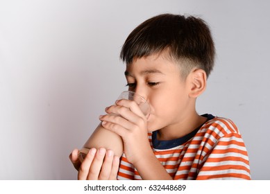 Close Up Of Little Boy Drinking Chocolate Milk 