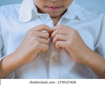 Close Up Of A Little Boy Learning Get Dressed, Buttoned White Shirt And Get Ready For School, Early Education Concept.