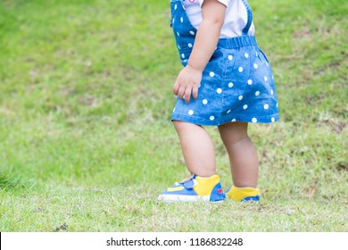 Close Up Little Girl Asian Happiness Running On Lawn, 1-2 Year Old