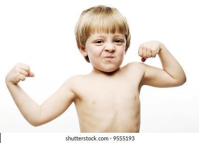 Close up of little strong man playing with muscles making faces - Shutterstock ID 9555193