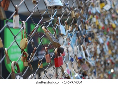 close up of locks  on wire mesh fence