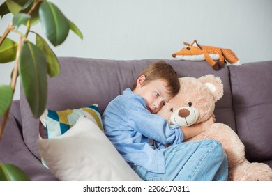 Close Up Lonely Little Boy Hugging Toy, Sitting At Home Alone, Upset Unhappy Child Waiting For Parents, Thinking About Problems, Bad Relationship In Family, Psychological Trauma