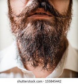 Close Up Of Long Beard And Mustache Man With White Shirt