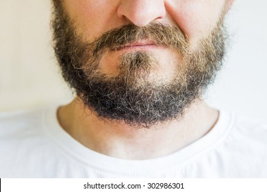 Close Up Of Long Beard And Mustache Man, Skeptic Expression