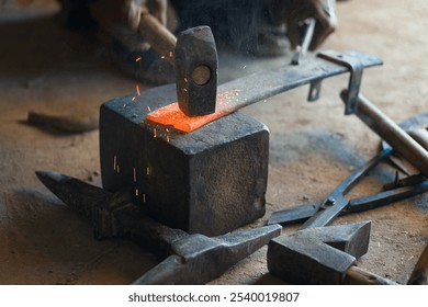 A close look at the strength and artistry of the blacksmith's hands at work