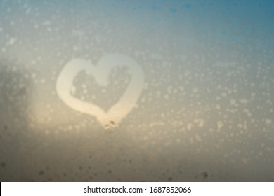 Close up of love heart drawn on natural fogged glass background. Window drops emotional shaped gesture - Shutterstock ID 1687852066