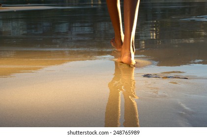 Close up low angle african american woman walking on beach