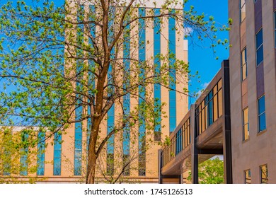 Close Up Of Lubbock County Courthouse Intersecting  With Other County Offices In The Town Square Area Of Lubbock, Texas. A Raised Walkway Connects The Buildings.