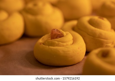 Close Up Of A Lussekatt Before Baking. Traditional Swedish Christmas Food. Saffron Flavored Dough With Raisins. Saffron Buns. 2