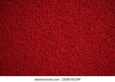 close up of a luxurious red carpet, featuring intricate woven patterns and a deep, rich hue - Powered by Shutterstock