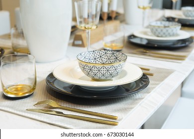 Close Up Of Luxury Gold Plate Setting On Table