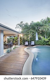 Close Up Of Luxury Swimming Pool In Apartment, Natural Trees And Green Grass Are Beautiful, Sunlight Around The Area, Weather Is Good, Outside Of A Home Garden.