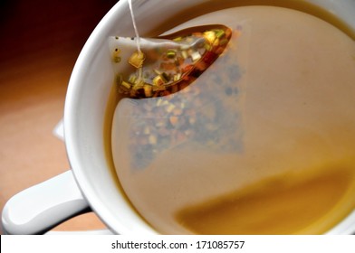 Close Up Of Luxury Tea Bag In Cup